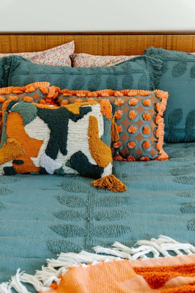 Decorative pillows and throws enhance the cozy, inviting atmosphere of this beautifully finished new.