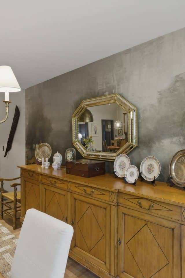 Elegant dining room with vintage accents and modern decor.