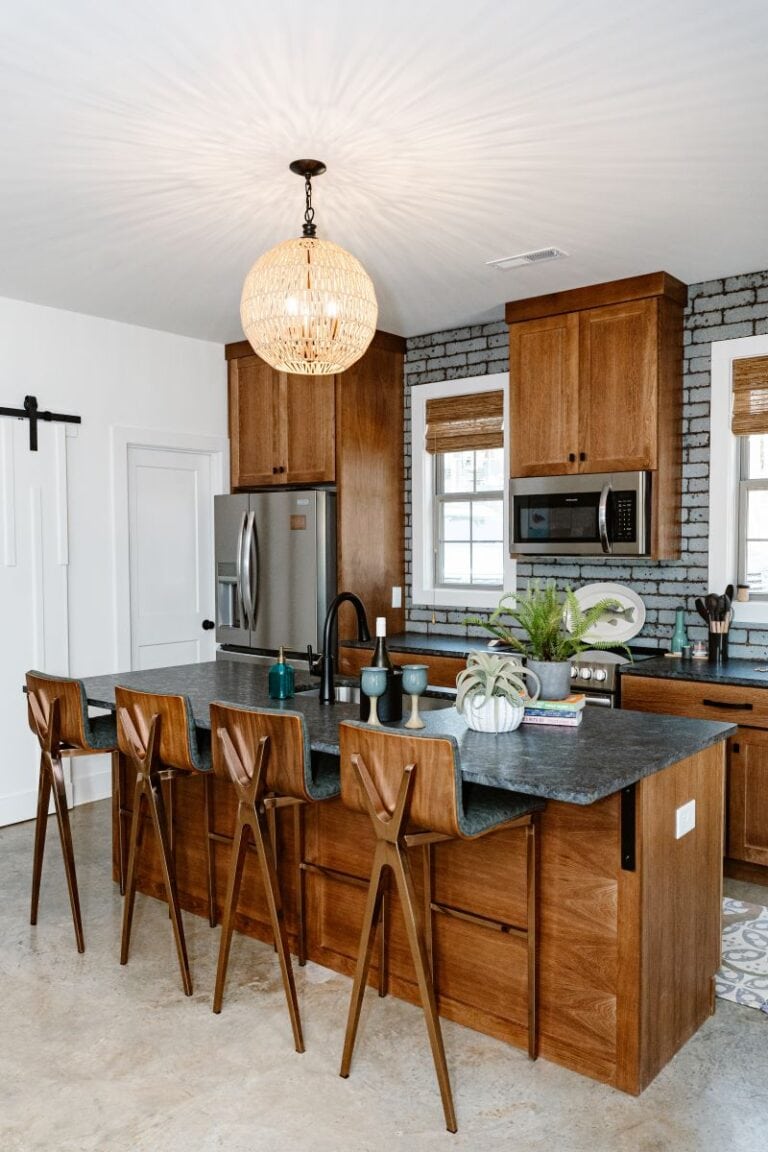 Stylish lakeside kitchen with wooden cabinets and modern appliances.