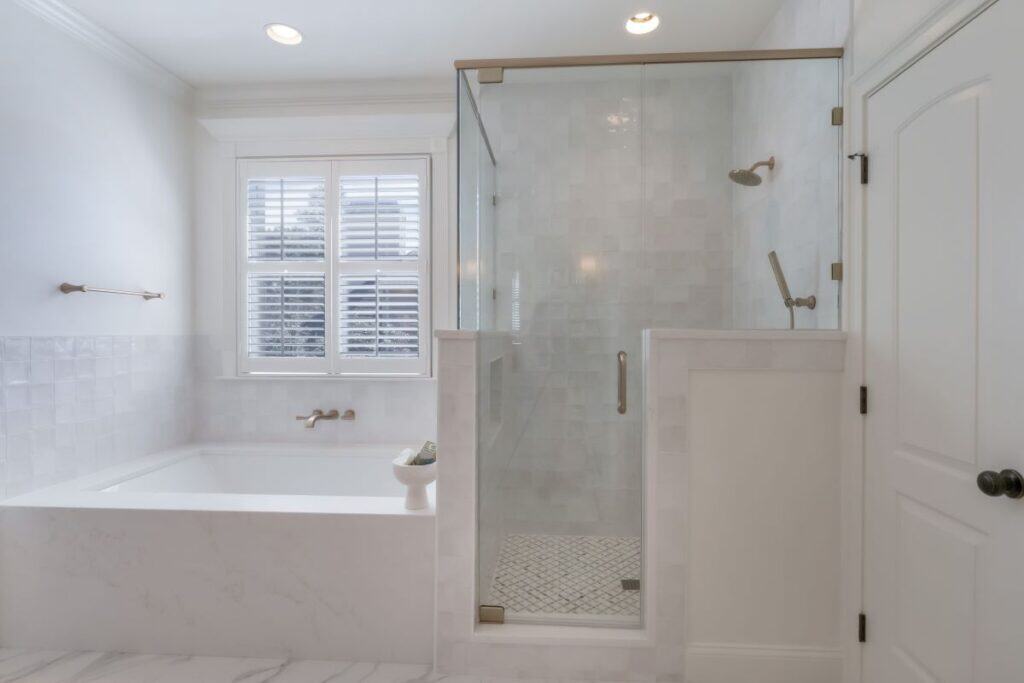 Modern Highland Lakes bathroom with walk-in shower and bathtub.