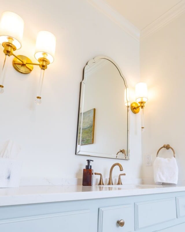 Beautiful Highland Lakes bathroom with elegant lighting and mirror.