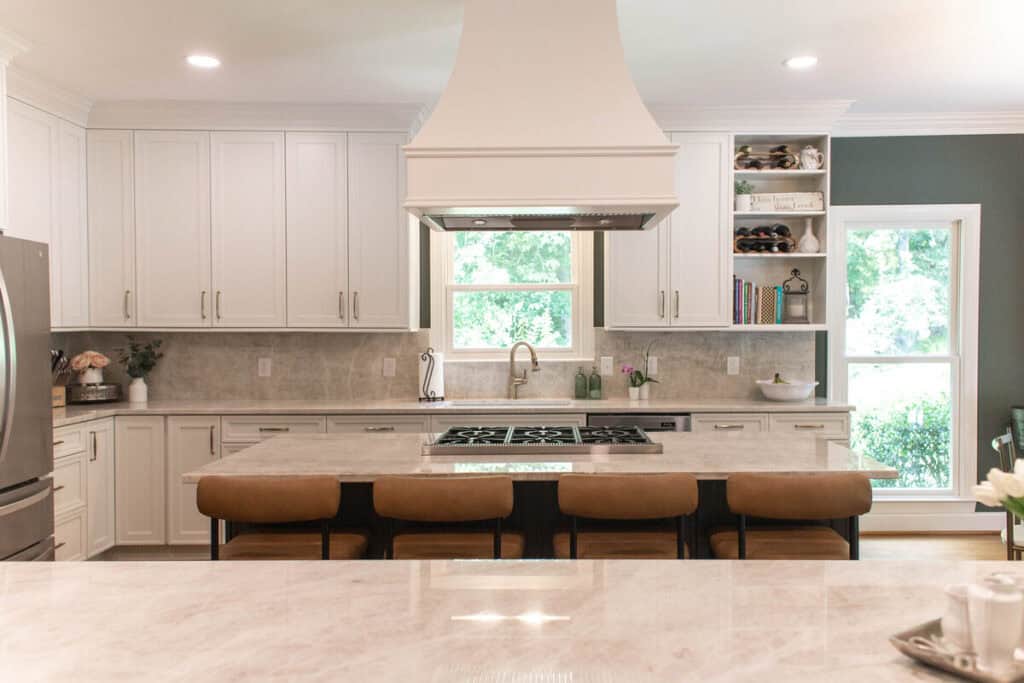 Bright modern kitchen with white cabinets and a large island.