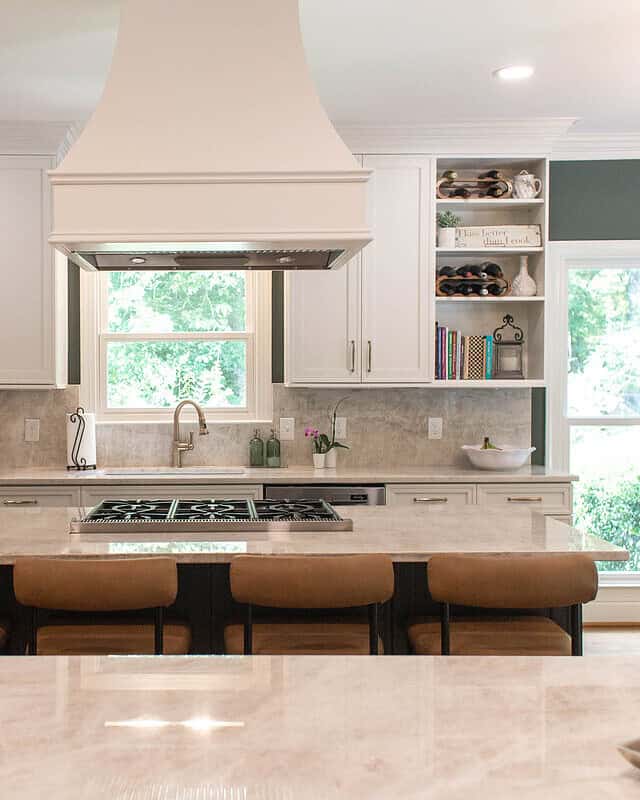 Bright modern kitchen with white cabinets and a large island.